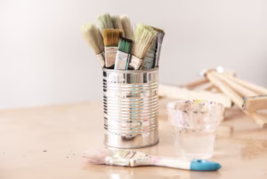 tin can with paint brushes