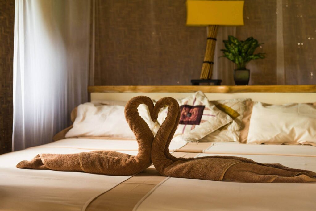 elegant bed with swan towels